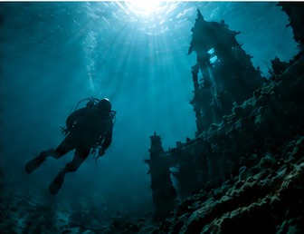 Diver over a wreck Diver over a wreck